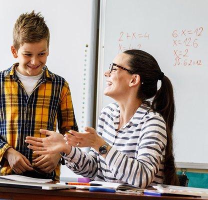 student receiving one-to-one instruction from teacher