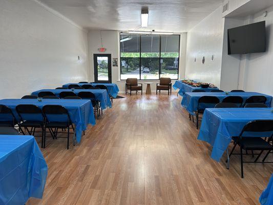 See our venue's simple charm, ready for events with tastefully arranged tables and chairs in Toledo.