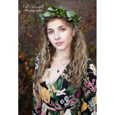 A styled photo session with flower crown from Fairytale Floral and dress by Susan Loves William Boutique