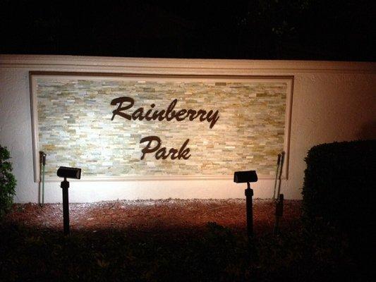 Plastic formed lettering stud mounted onto monument wall