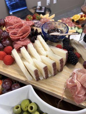 Goat cheese, assorted fruit, meats, spreads, and bread