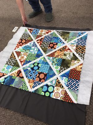 Finished her window pane quilt