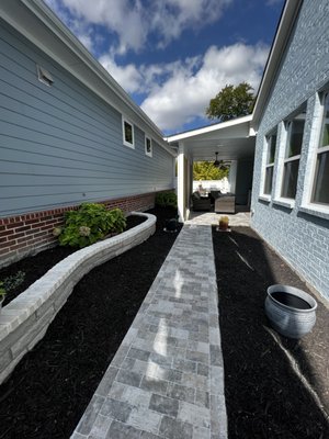 Beautiful walkway with brand flowerbeds and new mulch!