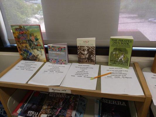 What a great idea - an ongoing silent auction for special books!