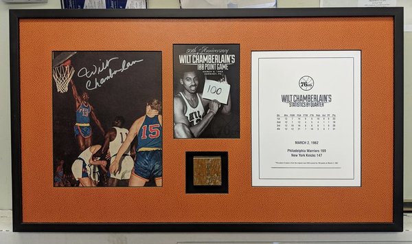 Framed Wilt Chamberlain score sheet, photos, and gym floor cut out. We used basketball style mat board and a shadowbox to frame this piece.