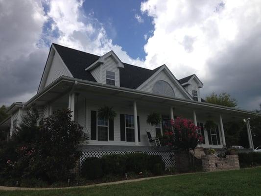 We pressure washed all surfaces of this house and came back after drying and painted wood areas of home