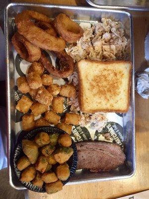 Onion rings, tater tots, fried okra, brisket, toast, and chicken.