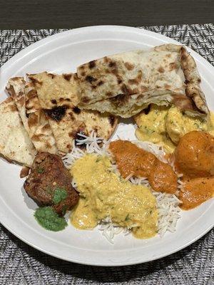 Barra kebab, butter chicken, coconut prawns, naan & roti.