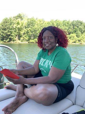 My honey relaxing on the stern lounge chairs of the "knot on call" pontoon.