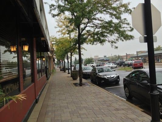 Park avenue (towards Courageous Bakery, of course), right by Metra station.