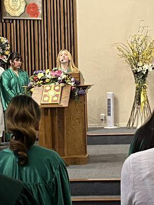 Oldest daughter speaking at her graduation