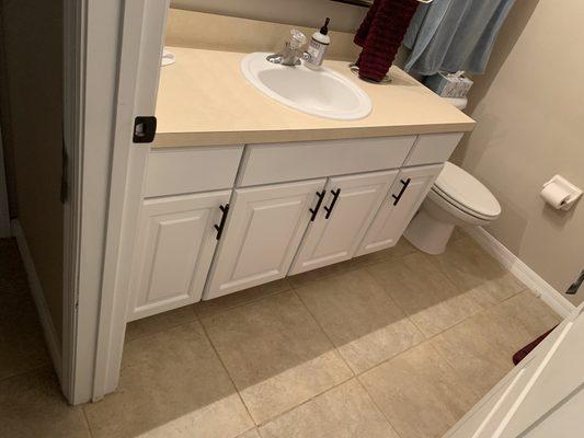 Bathroom cabinets painted to match the kitchen