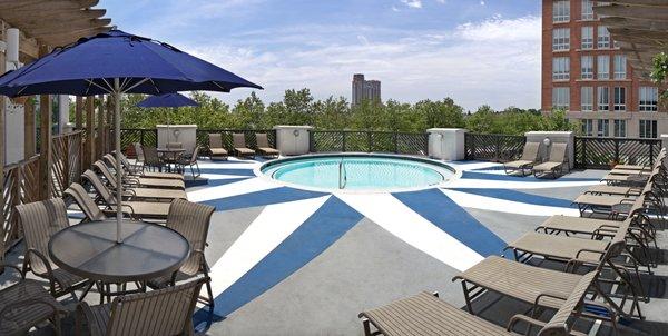 Enjoy stunning treeline views of Harbor East while laying poolside