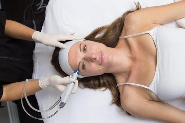 Picture of the HydraFacial MD Treatment being performed.