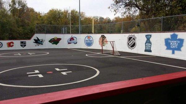 One end of rink with logos.