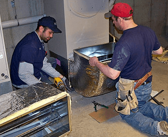 Our men installing duct work on a new install