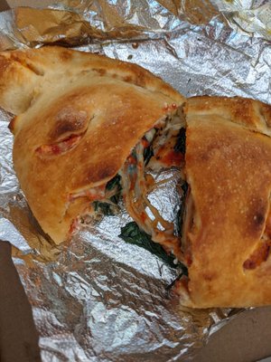 Spinach and mushroom calzone. Lots of mozzarella and ricotta cheese.