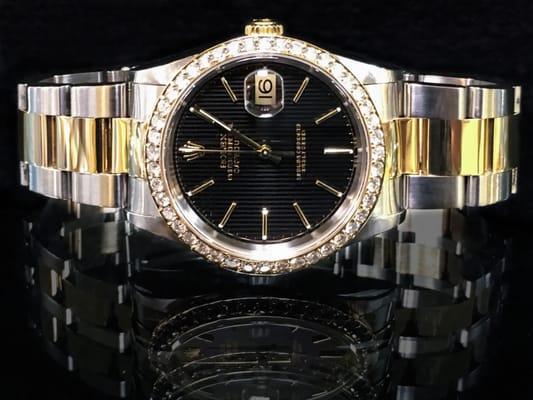 Two-Tone Datejust Rolex with a tapestry dial and 1.5 carat diamond bezel.