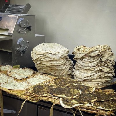 Fresh-baked flatbreads with and without zaatar