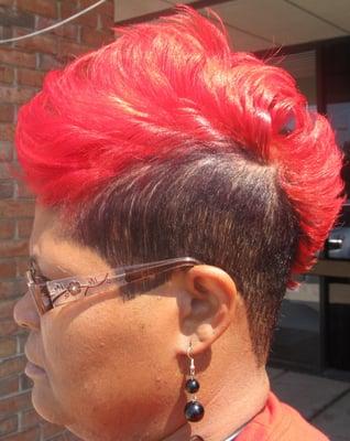 Mohawk haircut with red hot semi permanent color.