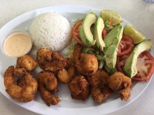 Fried jumbo shrimps with side dishes including sweet plantains $12