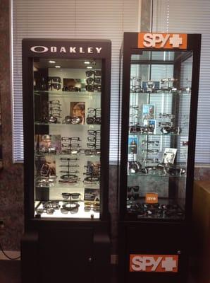 We offer Spy & Oakley. Make an appointment today to check out our sunglass selection!