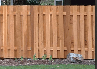 Good Neighbor style privacy fencing built with red ceder