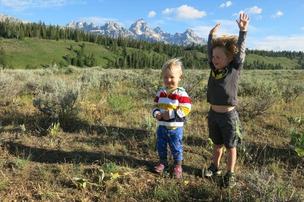 Taking a break to stretch with the Tetons in the background