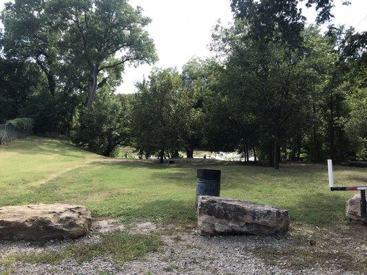 The path to the river, plenty of trash cans around