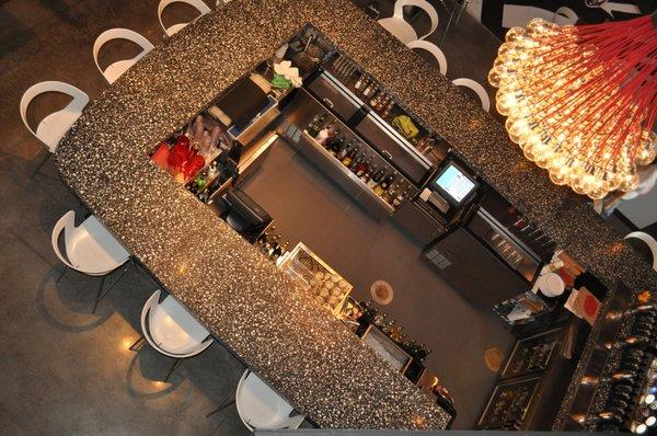 Black finish concrete bartop with crushed oyster shells installed for Mellow Mushroom in Charleston, SC