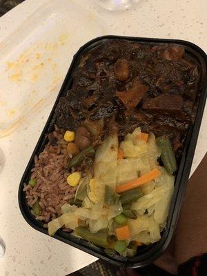 Oxtails rice and peas with steam vegetables