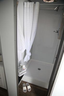 One of the lockable shower stalls inside our Bob's Premium Privies shower trailer.