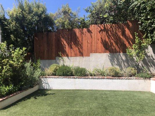 Redwood fence installed.