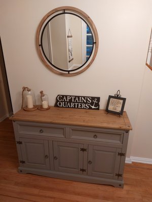 Assembled buffet table, hung mirror, installed baseboard molding, removed wall paper and repainted,