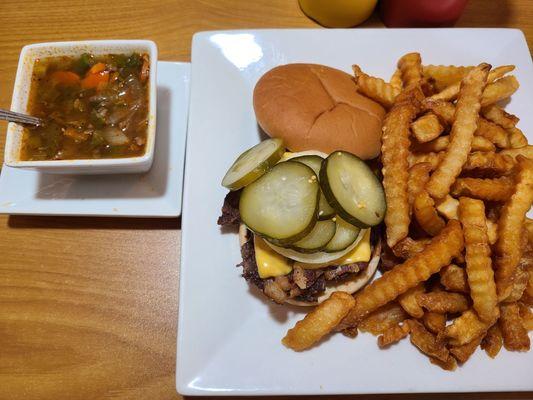 Bacon cheeseburger with fries ordered extra crisp and a vegetable beef soup.