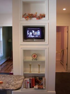 Marblehead Kitchen, Elaine lives to watch cooking shows and cook. Theme shelves change with every holiday.