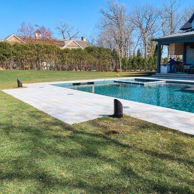 Avidia installed Coastal Source Ellipse Bollard speakers by the pool, reducing neighbor noise and integrating with the existing Sonos system