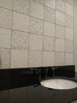 Antiqued Terra Cotta weathered tile from Spain made a great accent to this bathroom!