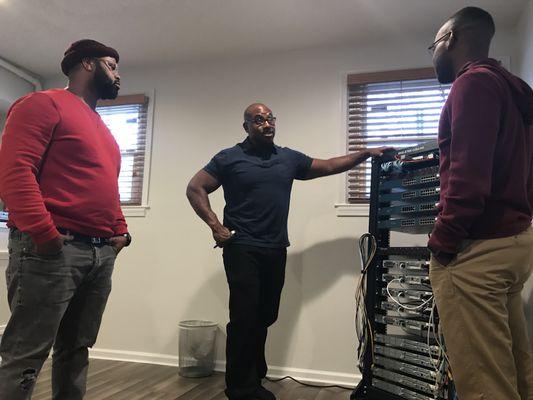 Our instructor showing the Cisco rack equipment used for the Cisco classes.