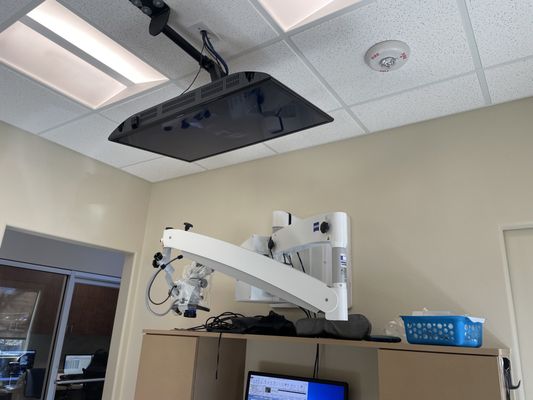 TV above a dental chair.  Nice concept!