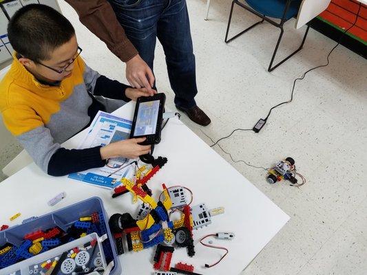 Future computer scientist coding his first robot!