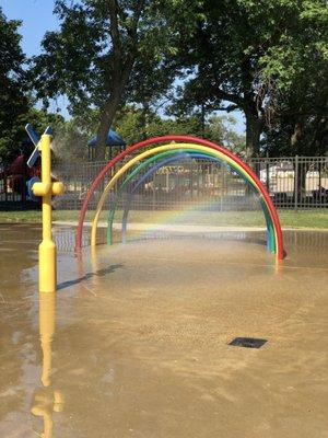 Splash pad with a double rainbow