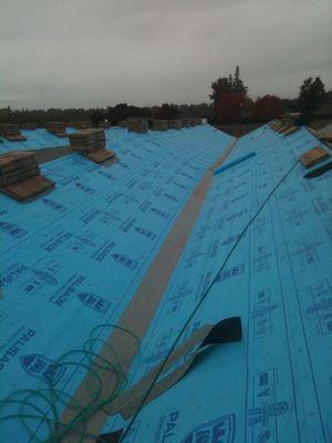 Synthetic felt waterproof layer, ready for roof installation.