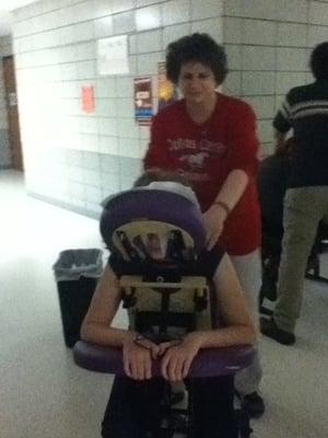 Jill giving on-site chair massage at DC-G's after prom party.