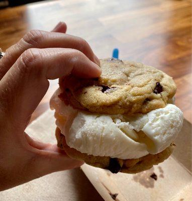 Custom ice cream sandwich- chocolate chip cookie (warmed) with old fashioned vanilla ice cream