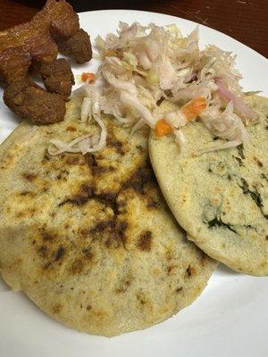 Pupusa de loroco, and pupusa de chicharrón. Also a side of chicharrón frito. And it comes with curtido, a pickled cabbage salad.