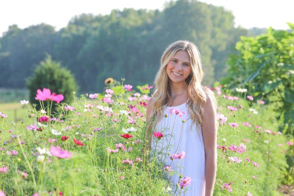 Portrait of a high school senior girl in the flowers at our flower farm studio in Brooks, GA.