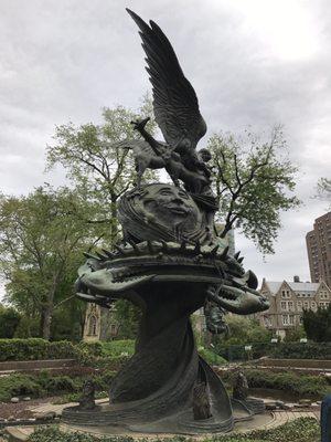 Satan's head dangles after being slain by Archangel Michael.