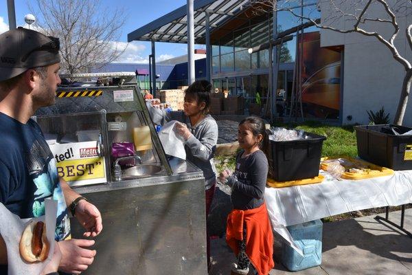 Our daughter and niece volunteering, helping the flood victims of San Jose.