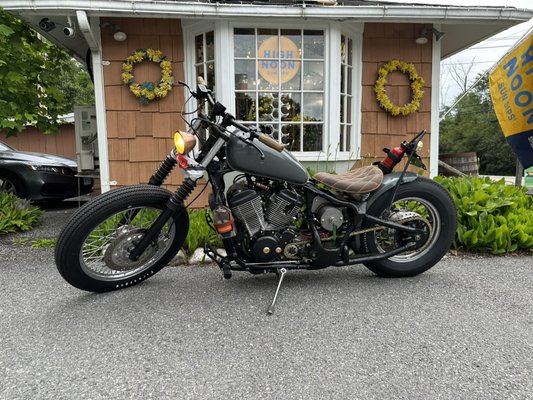 Custom motorcycle by our talented customer outside Salem Wine and Liquoe